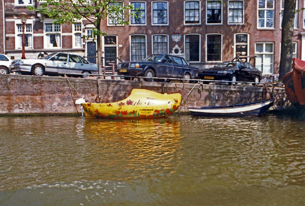Wooden Shoe-Shaped Boat on an Amsterdam Canal, Netherlands Photo
